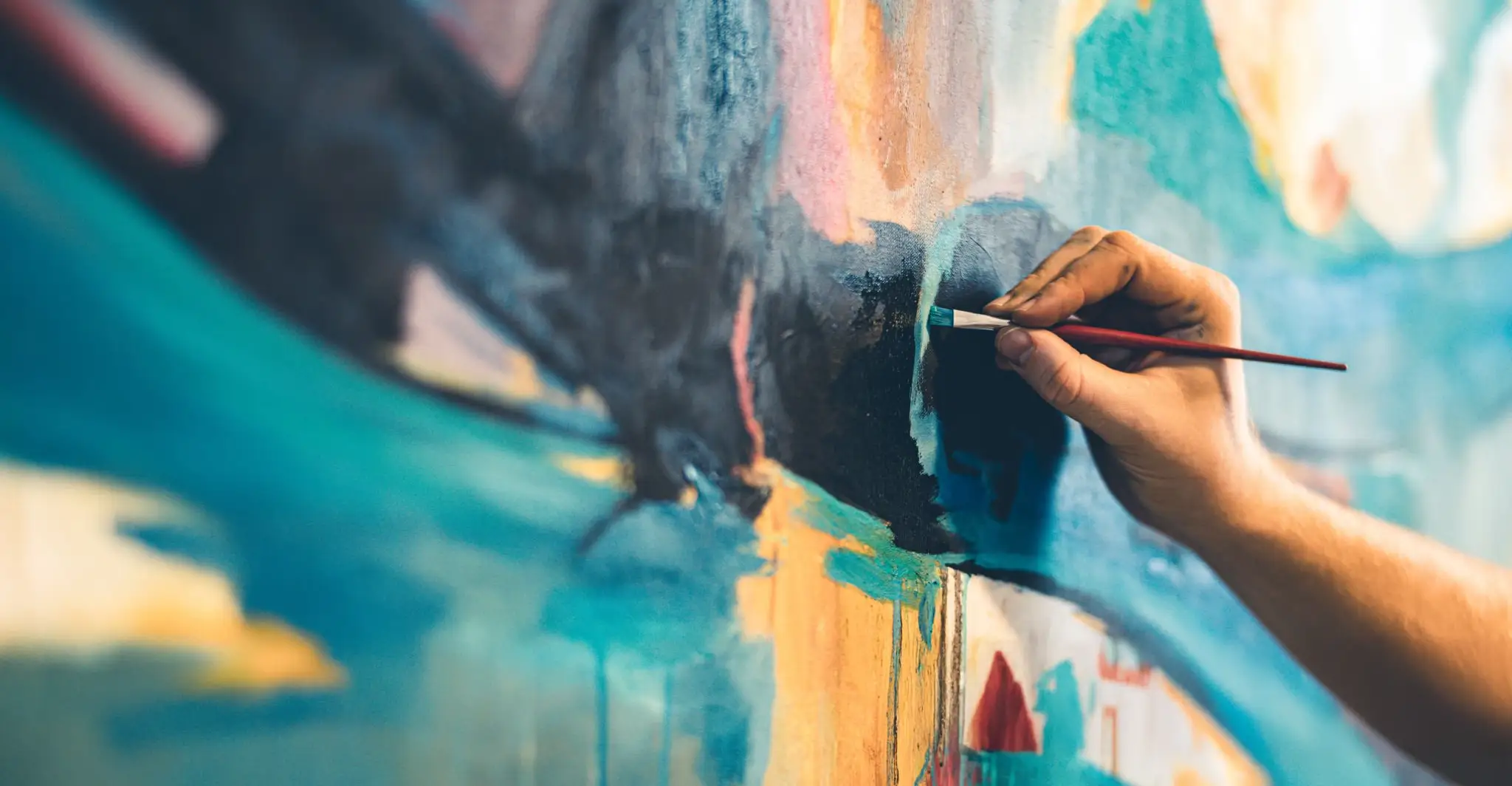 Hands of Young painter working on his art