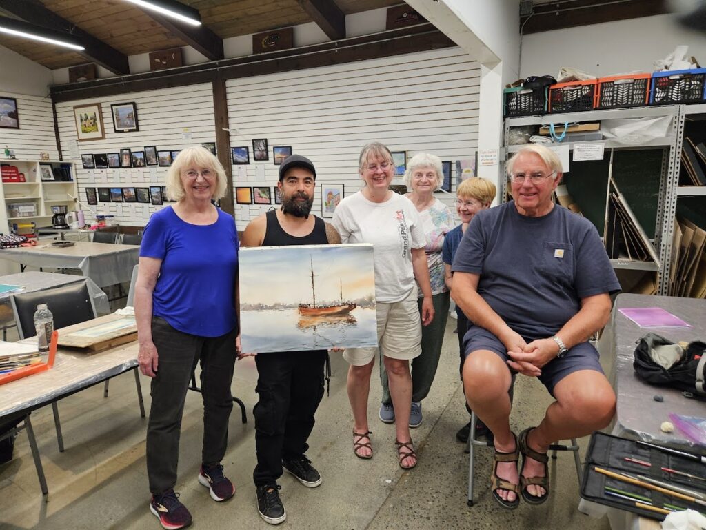 art-workshops-with-participants-showing-their-paintings